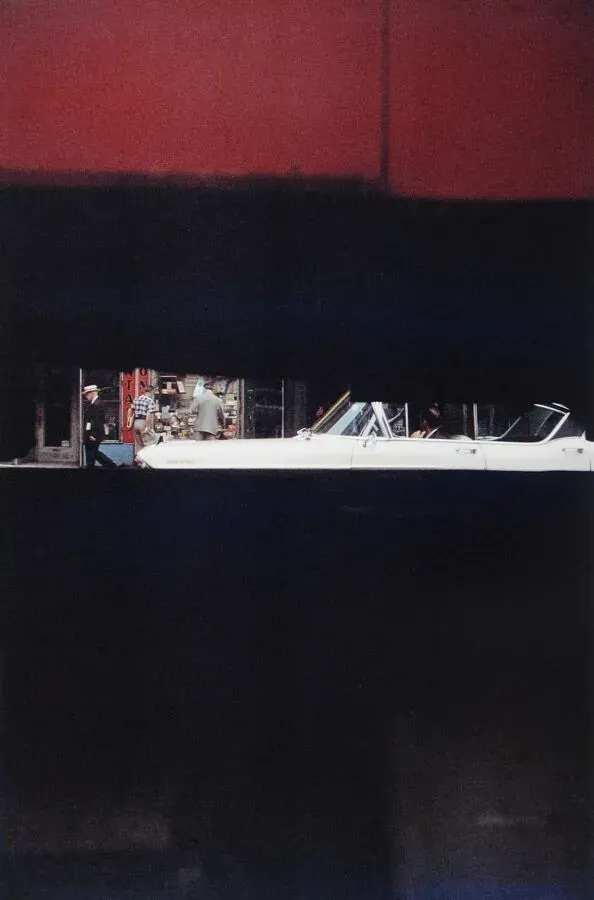 Saul Leiter’s Street Slice: Abstraction Held Together by a White Convertible