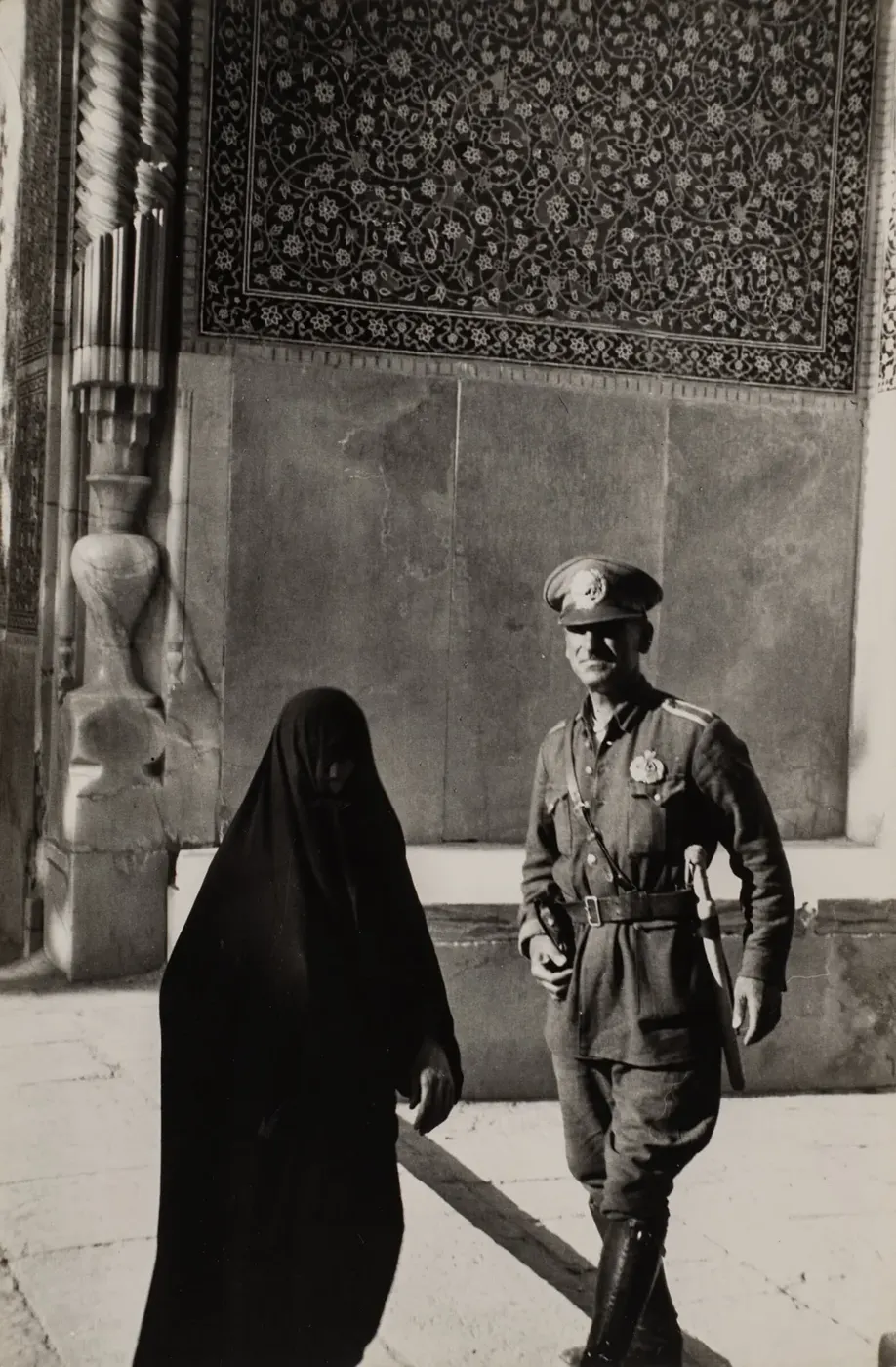 A Charged Encounter Framed by Pattern and Light (Henri Cartier-Bresson)