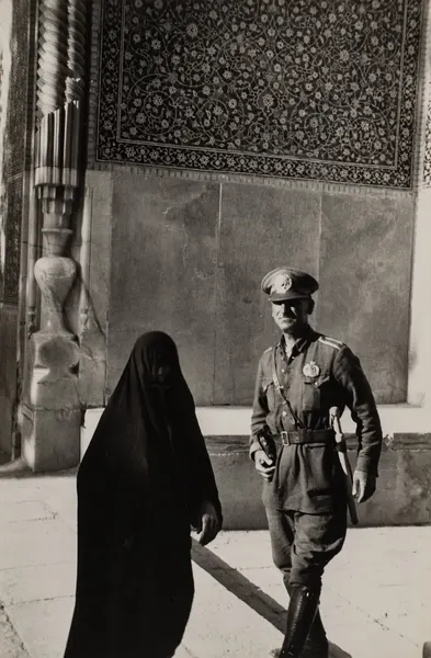 A Charged Encounter Framed by Pattern and Light (Henri Cartier-Bresson)