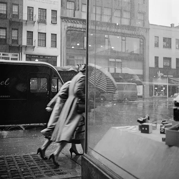 Rain, Motion, and Glass on a City Corner