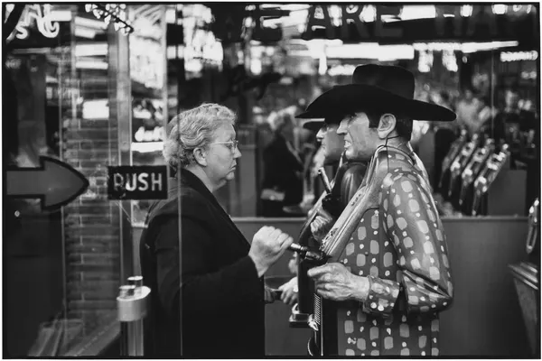 Las Vegas: A Charged Street Encounter in Monochrome by Elliott Erwitt
